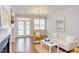 Cozy living room with fireplace, french doors, and a comfortable seating arrangement with pops of color at 604 Copperline Dr # 108, Chapel Hill, NC 27516