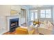 Bright living room features a fireplace, built-in cabinets, and a cozy seating area with neutral tones at 604 Copperline Dr # 108, Chapel Hill, NC 27516