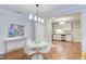 Open concept, with dining area flowing into a kitchen with stainless steel appliances at 604 Copperline Dr # 108, Chapel Hill, NC 27516