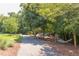 Picturesque walking path leading to a playground and hammock area surrounded by lush greenery, offering recreational opportunities at 604 Copperline Dr # 108, Chapel Hill, NC 27516