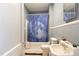 Bathroom featuring a shower/tub combo and a blue shower curtain at 616 N Mebane St, Burlington, NC 27217