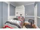 Cozy bedroom with built-in shelving, offering a comfortable and organized space at 616 N Mebane St, Burlington, NC 27217