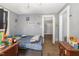 This is a cozy bedroom featuring grey painted walls and a doorway to another room at 616 N Mebane St, Burlington, NC 27217