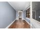 View of empty room with hardwood floors and access to other rooms at 616 N Mebane St, Burlington, NC 27217
