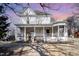 Charming two-story home featuring a classic wrap-around porch and decorative architectural details at 616 N Mebane St, Burlington, NC 27217