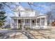 Charming two-story home featuring a classic wrap-around porch and decorative architectural details at 616 N Mebane St, Burlington, NC 27217