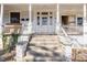 Image of the home's front porch with steps leading to the front door at 616 N Mebane St, Burlington, NC 27217
