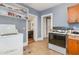 Compact kitchen with a view to the living room, perfect for casual cooking and dining at 616 N Mebane St, Burlington, NC 27217