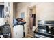 A functional kitchen area with modern stainless steel appliances and access to the bathroom at 616 N Mebane St, Burlington, NC 27217