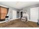 Inviting living room features carpet, a window, and access to other rooms in the home at 616 N Mebane St, Burlington, NC 27217