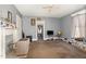 Cozy living room with ceiling fan and lots of natural light throughout the space at 616 N Mebane St, Burlington, NC 27217