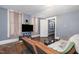 Cozy living room with hardwood floors, comfortable seating, and a television at 616 N Mebane St, Burlington, NC 27217