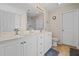 Bright bathroom featuring a double sink vanity and a separate toilet room at 66 Newbury Dr, Angier, NC 27501
