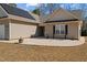 Inviting home facade with stone landscaping and a well-maintained lawn at 66 Newbury Dr, Angier, NC 27501
