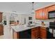 Open concept kitchen with granite countertops and ample cabinet space overlooking the dining room at 66 Newbury Dr, Angier, NC 27501