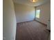 Neutral bedroom featuring carpeted floor, a window and a ceiling light at 72 E Victory View Ter, Smithfield, NC 27577