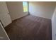 Neutral bedroom featuring carpeted floor and a window with natural light at 72 E Victory View Ter, Smithfield, NC 27577