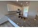 Spacious kitchen with granite countertops, stainless appliances, and white cabinets at 72 E Victory View Ter, Smithfield, NC 27577