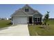 Charming single-Gathering home with a well-manicured lawn and a two-car garage at 73 E Victory View Ter, Smithfield, NC 27577