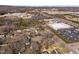 Bird's eye view of a residential community near commercial centers showcases convenient urban living in a wooded area at 74 Azalea Dr, Roxboro, NC 27573