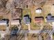An aerial view of the neighborhood shows homes with well-maintained yards and easy access to the local street at 74 Azalea Dr, Roxboro, NC 27573