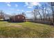 Large, fenced backyard provides ample space for outdoor activities and privacy at 74 Azalea Dr, Roxboro, NC 27573