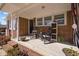 Relaxing front porch with rocking chairs and decorative plants at 74 Azalea Dr, Roxboro, NC 27573