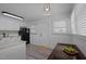 Bright kitchen with white cabinets, modern appliances, and light countertops at 74 Azalea Dr, Roxboro, NC 27573