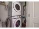 Compact laundry area with stacked Samsung washer and dryer, maximizing space and convenience at 74 Azalea Dr, Roxboro, NC 27573
