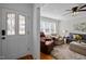 Inviting living room with hardwood floors, plush seating, and abundant natural light from large windows at 74 Azalea Dr, Roxboro, NC 27573