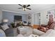 Comfortable living room featuring a fireplace, neutral decor, and plenty of seating at 74 Azalea Dr, Roxboro, NC 27573