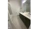 Modern bathroom featuring a dual sink vanity, gray tile floor and a shower-tub combination at 80 Valebrook Ct, Youngsville, NC 27596