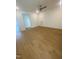 Spacious bedroom with wood flooring, ceiling fan, and ample natural light at 80 Valebrook Ct, Youngsville, NC 27596