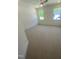 Well-lit bedroom with soft carpeting, large windows, and a ceiling fan at 80 Valebrook Ct, Youngsville, NC 27596