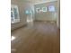 Open dining room area with hardwood floors, recessed lighting, and sliding door access to a deck at 80 Valebrook Ct, Youngsville, NC 27596