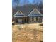 Charming single-Gathering home featuring stone accents, a covered porch, and a classic design at 80 Valebrook Ct, Youngsville, NC 27596