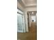 Bright hallway with hardwood floors, crown molding, and white trim at 80 Valebrook Ct, Youngsville, NC 27596