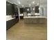 Modern kitchen with stainless steel appliances, a large island, and custom cabinetry at 80 Valebrook Ct, Youngsville, NC 27596