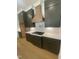 Stylish kitchen with quartz countertops, a gas range, and custom range hood at 80 Valebrook Ct, Youngsville, NC 27596