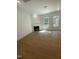 Cozy living room with hardwood floors, a fireplace, and plenty of natural light at 80 Valebrook Ct, Youngsville, NC 27596