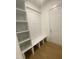 Functional mudroom featuring a built-in bench, coat hooks, and storage shelves at 80 Valebrook Ct, Youngsville, NC 27596