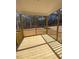 Inviting screened porch with wood floors and railings, perfect for enjoying the outdoors in comfort at 80 Valebrook Ct, Youngsville, NC 27596