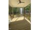 A relaxing screened porch featuring natural wood and scenic views offering a serene outdoor experience at 80 Valebrook Ct, Youngsville, NC 27596