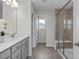 Beautiful bathroom with double sinks, a glass-enclosed shower, and modern fixtures at 82 Fairwinds Dr, Lillington, NC 27546