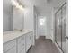 Clean bathroom with a large vanity, ample counter space, and a glass-enclosed shower at 82 Fairwinds Dr, Lillington, NC 27546