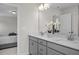 Bright bathroom featuring double sinks, neutral cabinets, and modern decor at 82 Fairwinds Dr, Lillington, NC 27546