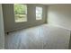 Bright, spacious bedroom with large windows and floors are covered with construction plastic at 82 Fairwinds Dr, Lillington, NC 27546