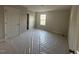 Spacious bedroom with a window and fresh paint, ready for your personal touch at 82 Fairwinds Dr, Lillington, NC 27546