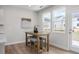 Cozy breakfast area with a small table, chairs, and natural light from the backyard views at 82 Fairwinds Dr, Lillington, NC 27546