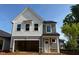 Charming two-story home featuring a modern design, a spacious garage, and a beautifully landscaped yard at 82 Fairwinds Dr, Lillington, NC 27546